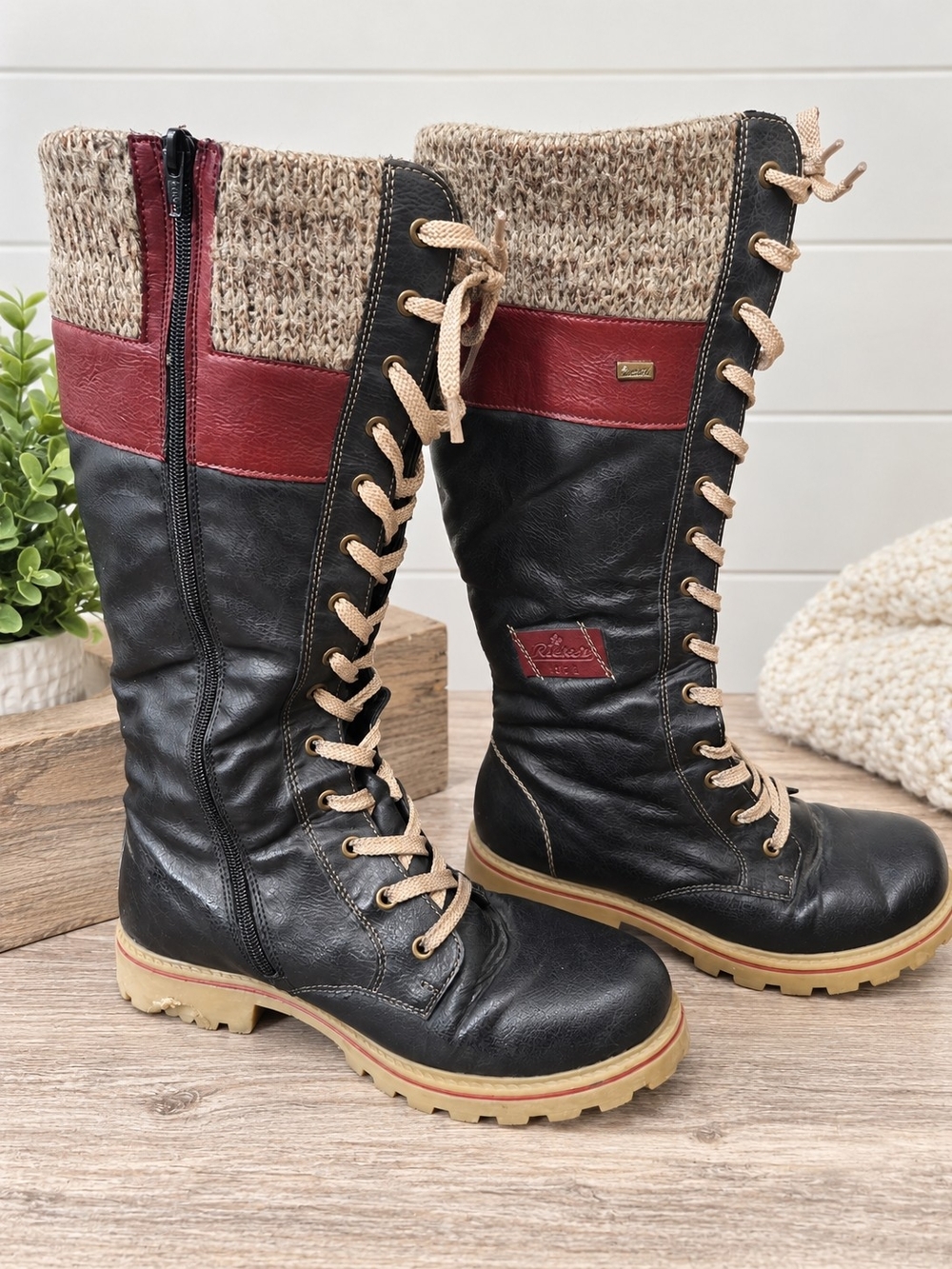 Rieker women’s tall lace-up boots in EU size 41. Stylish black design with burgu